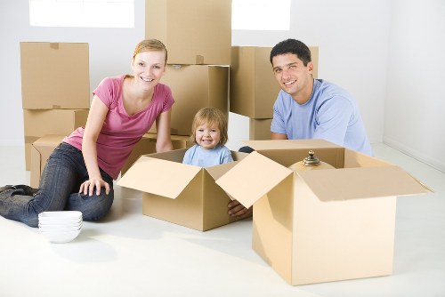 Removal team planning a house move in Richmond with packed boxes and furniture