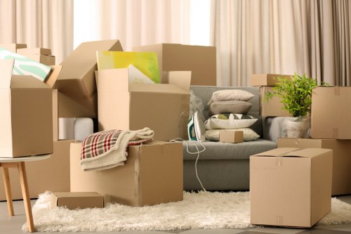 Staff separating recyclable materials such as cardboard and packaging at a storage facility